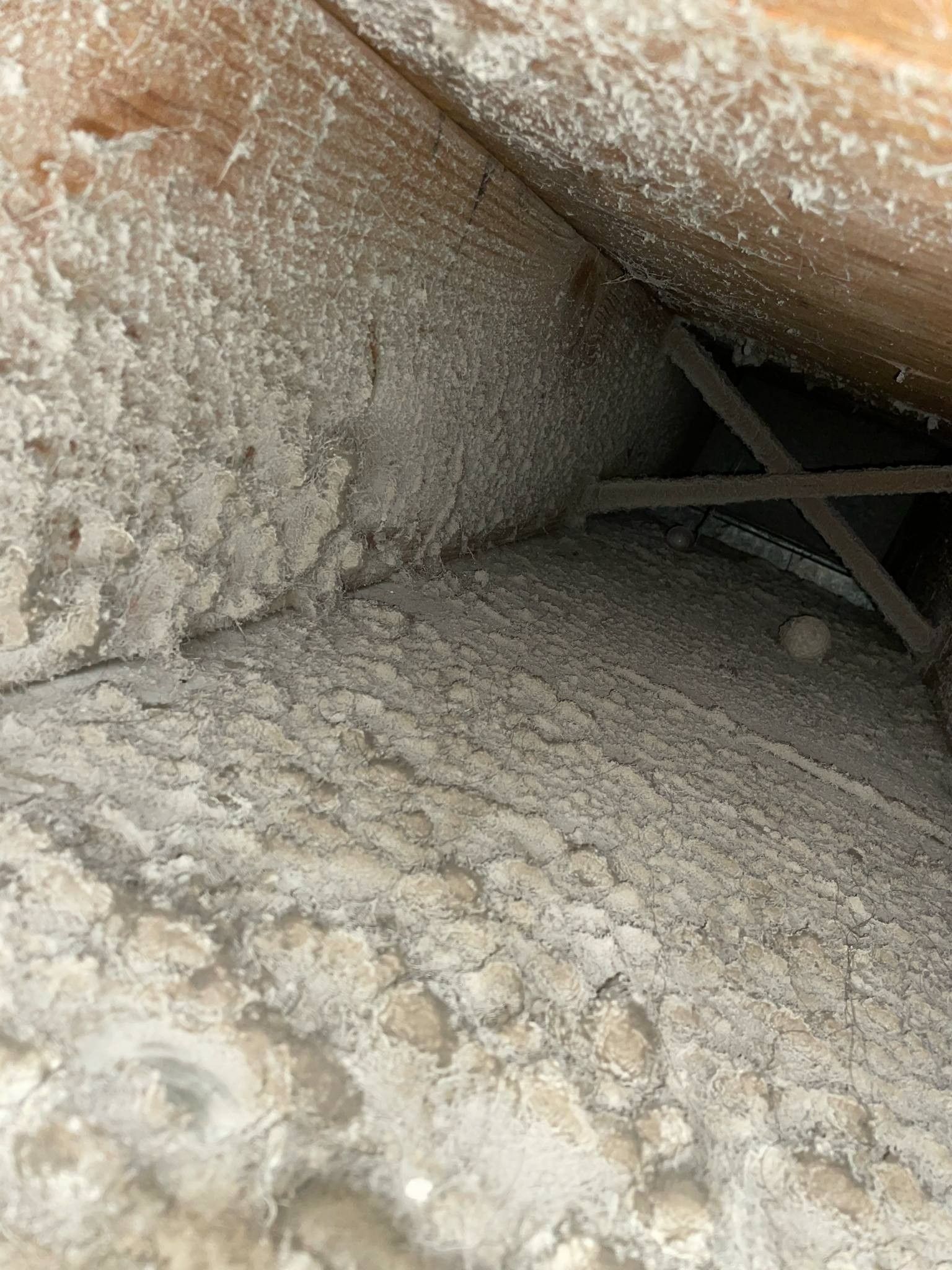 There is a lot of dust in the attic of a house.