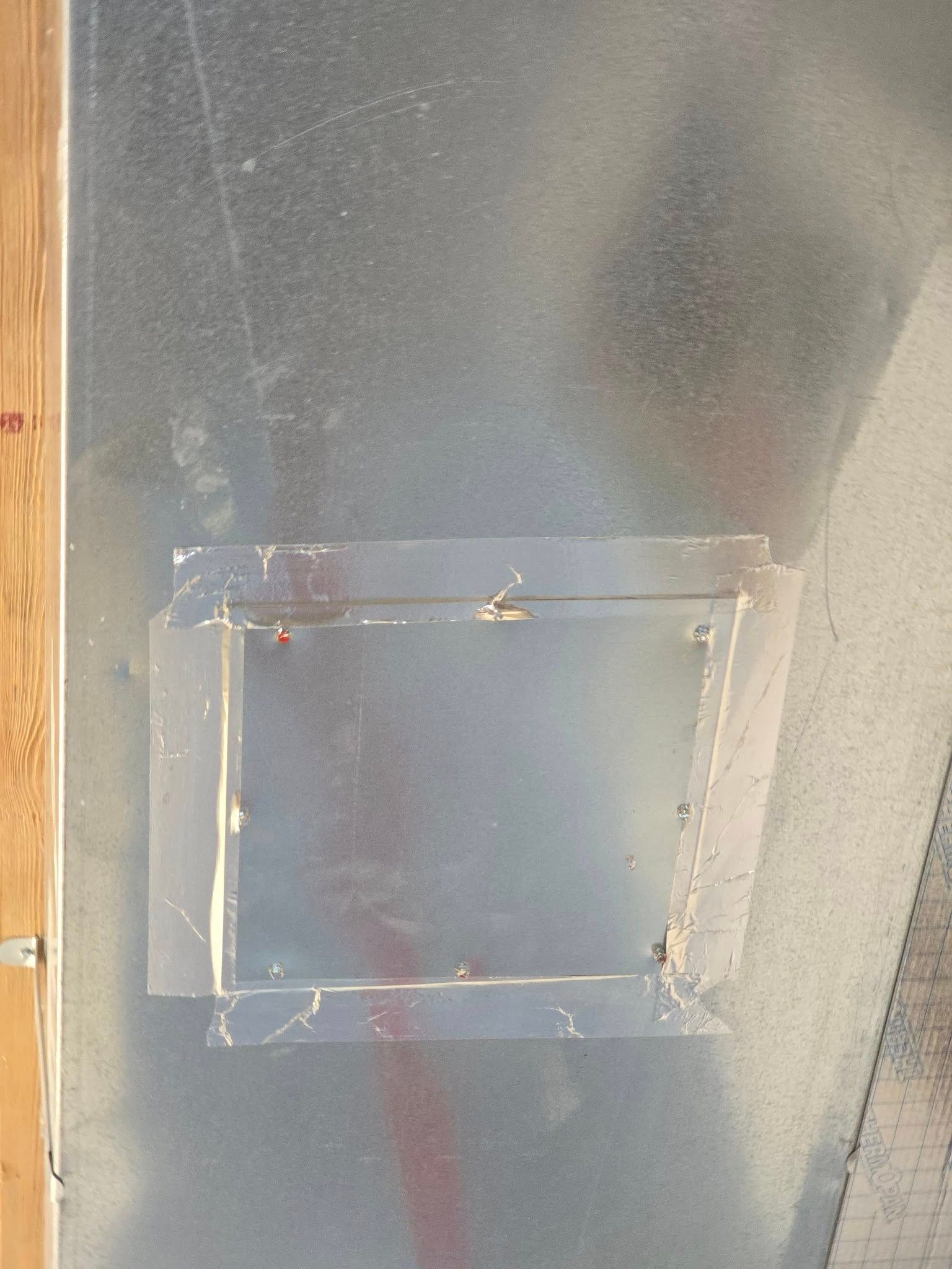 A close up of a piece of metal with a hole in it.