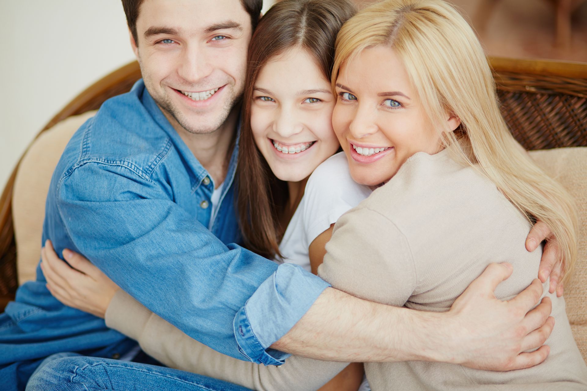 family smiling hugging | Top Dentist in Longmont, CO 80501