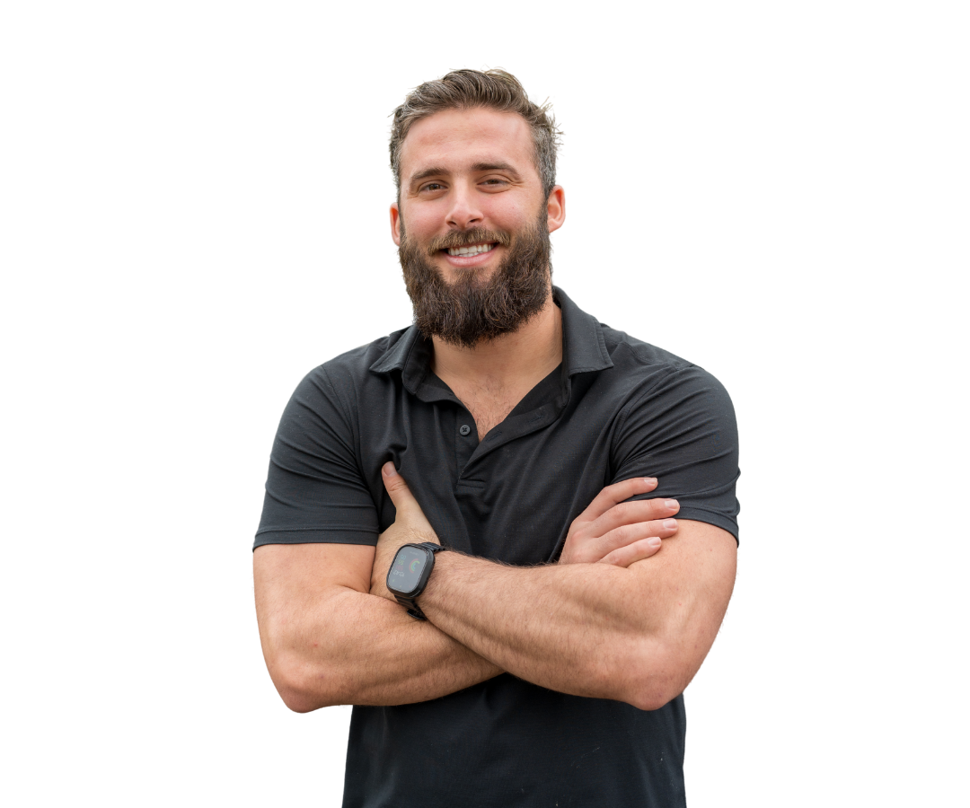 A man in a suit and white shirt is smiling for the camera.