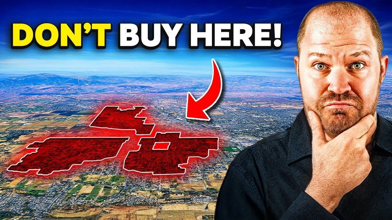 Man frowning, pointing to a red highlighted area on an aerial cityscape, titled 