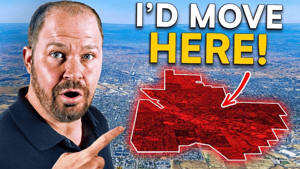 A man is pointing at a map with the words `` i 'd move here '' written on it.