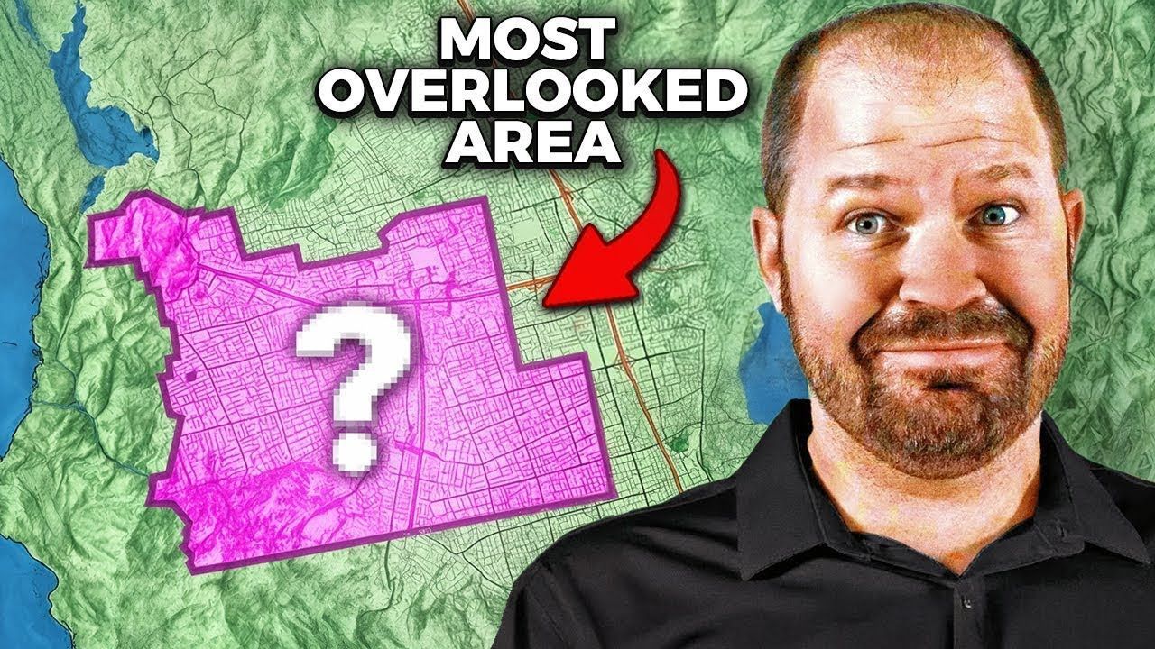 A man is standing in front of a map with a question mark on it.