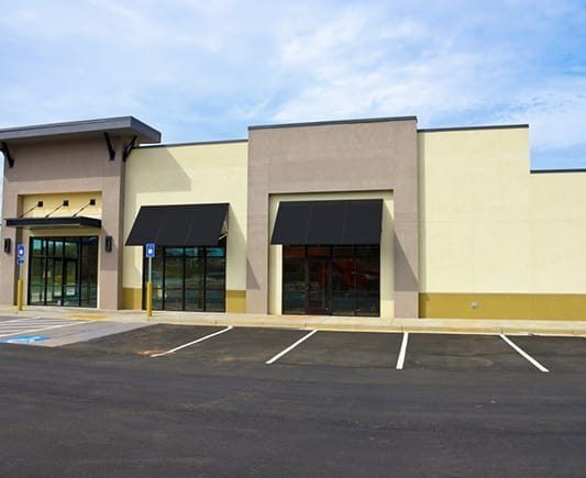 Exterior of a Newly Built, Empty Commercial Building — Property Transfer Professionals In Wyong, NSW