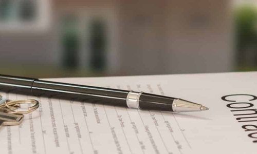 Pen on Contract Document; House Keys Beside — Property Transfer Professionals In Wyong, NSW