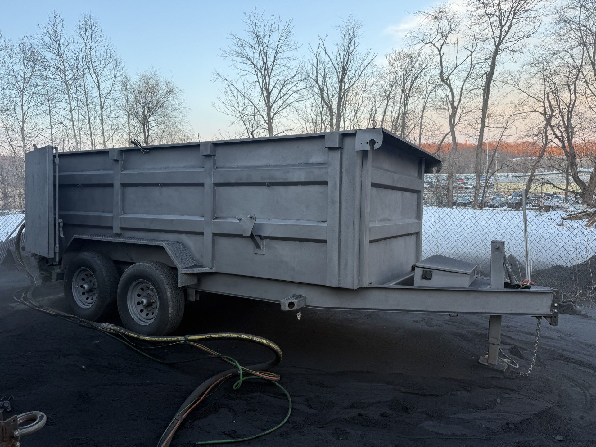 Sandblasted dump trailer before restoration with raw steel finish for bedliner coating prep