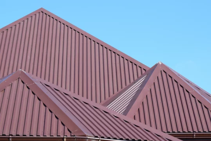 Vibrant red metal roofing sheets forming a durable and weather-resistant roof.