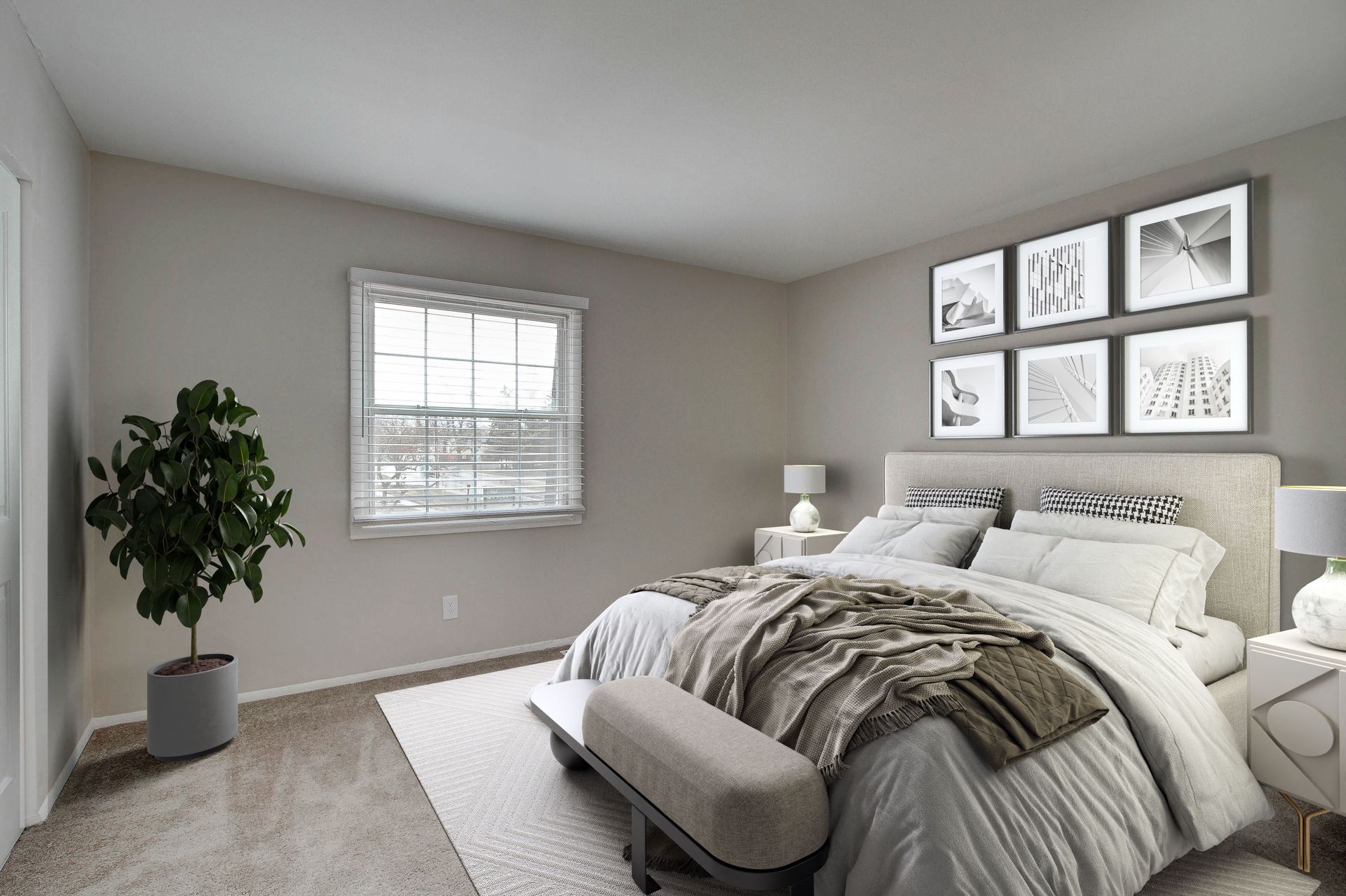Bedroom with bed, window, artwork, and plant in a neutral color scheme.