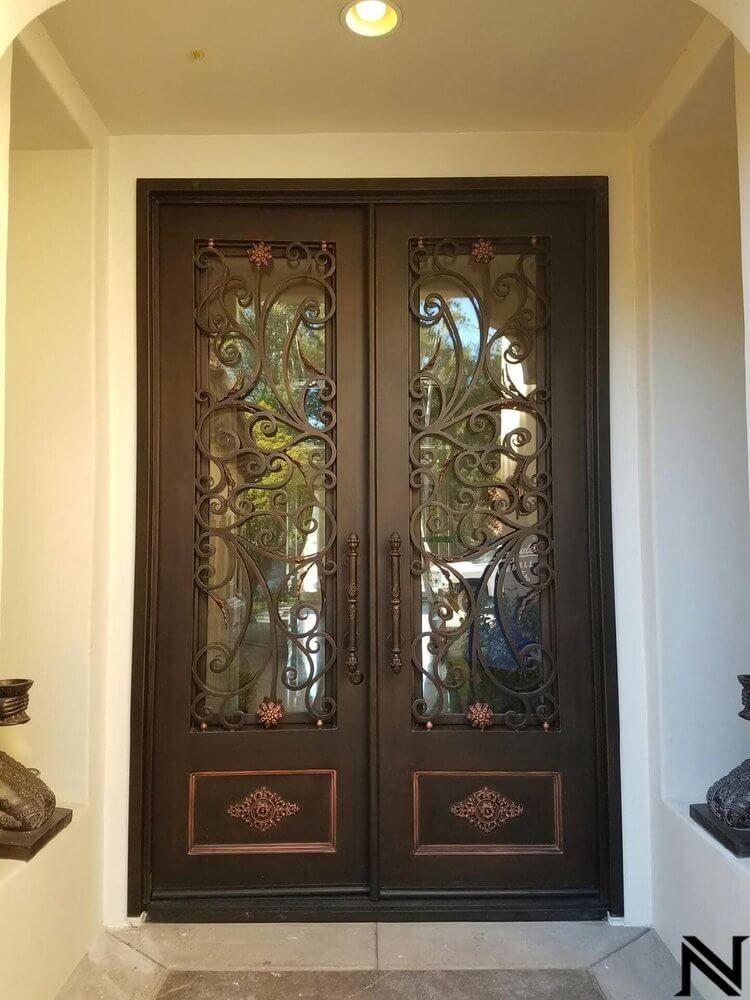 A pair of wrought iron doors in a house.