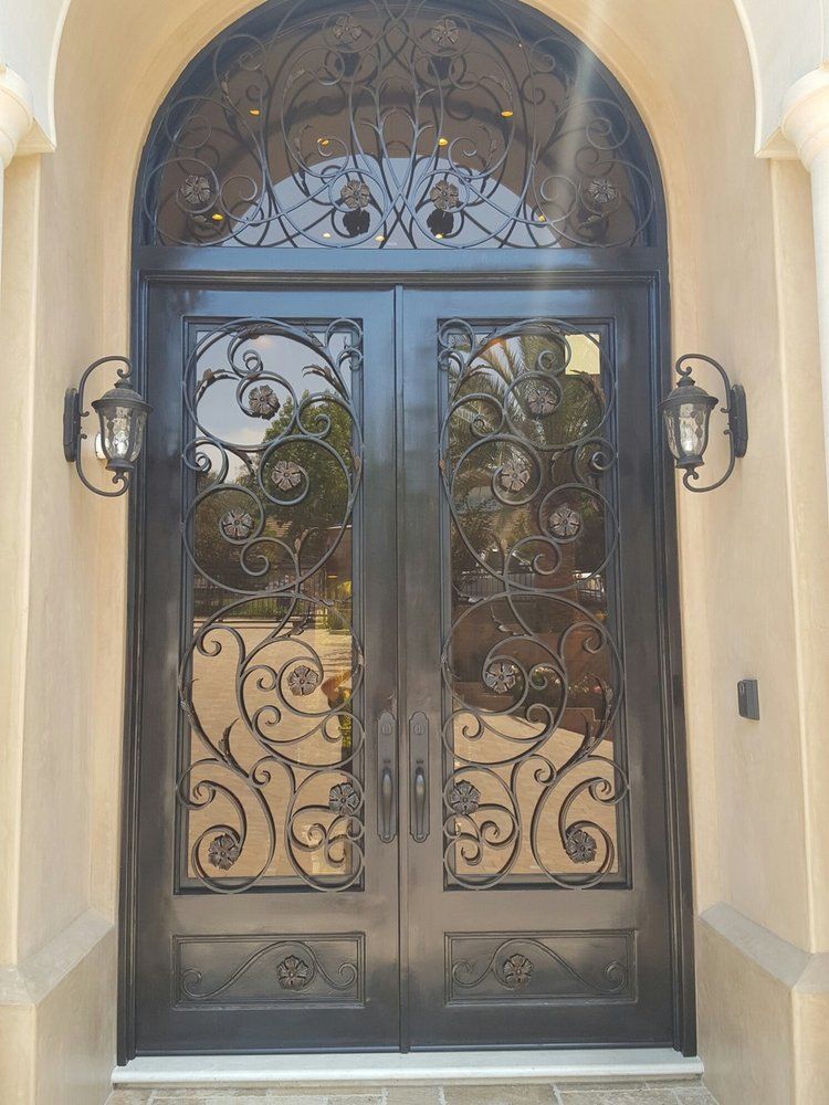 A door with a wrought iron design on it