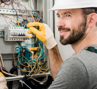 Electrician Repairing Electrical Box — North Alabama — Superior Electrical Service Inc.