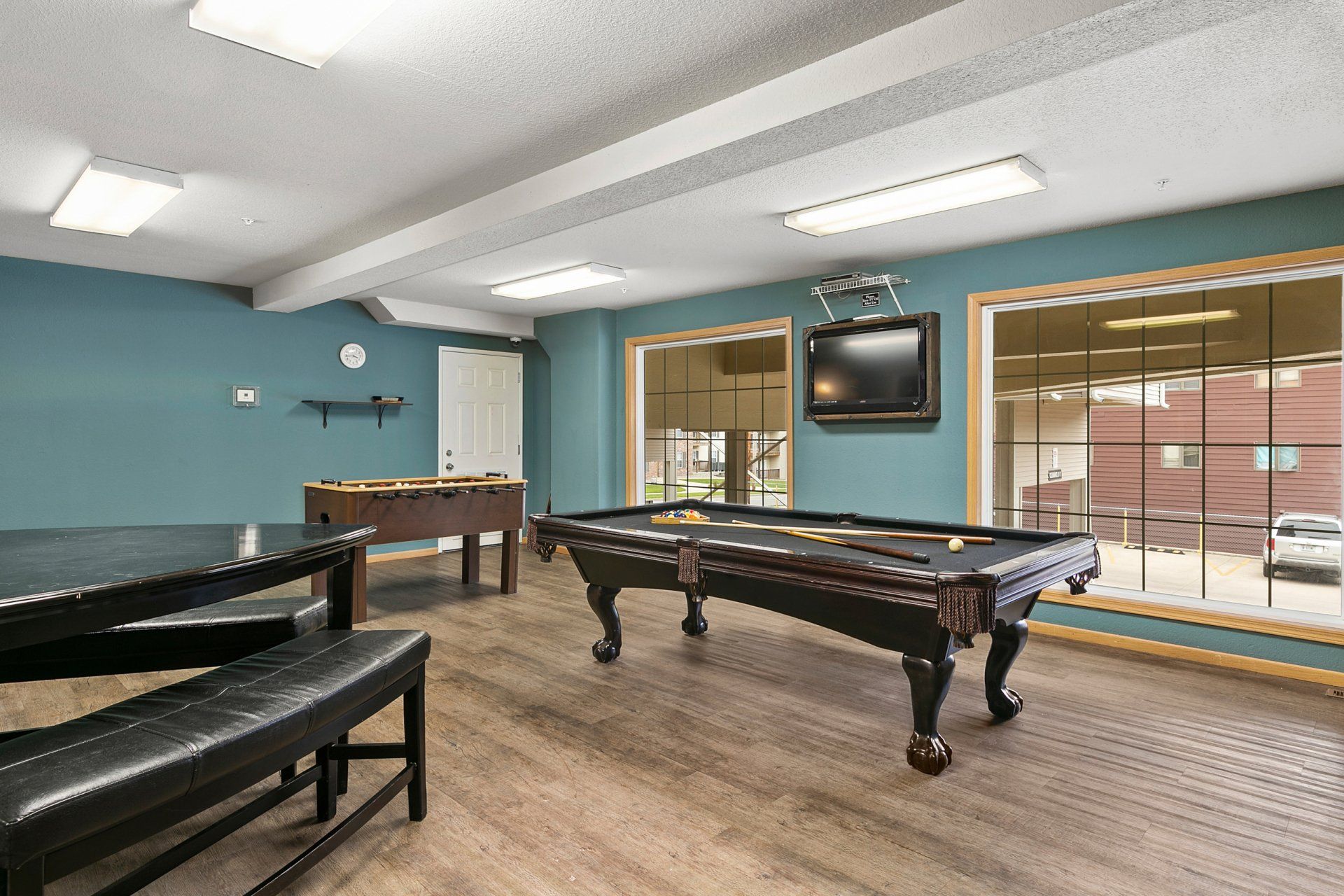 Community game room with pool table and foosball table