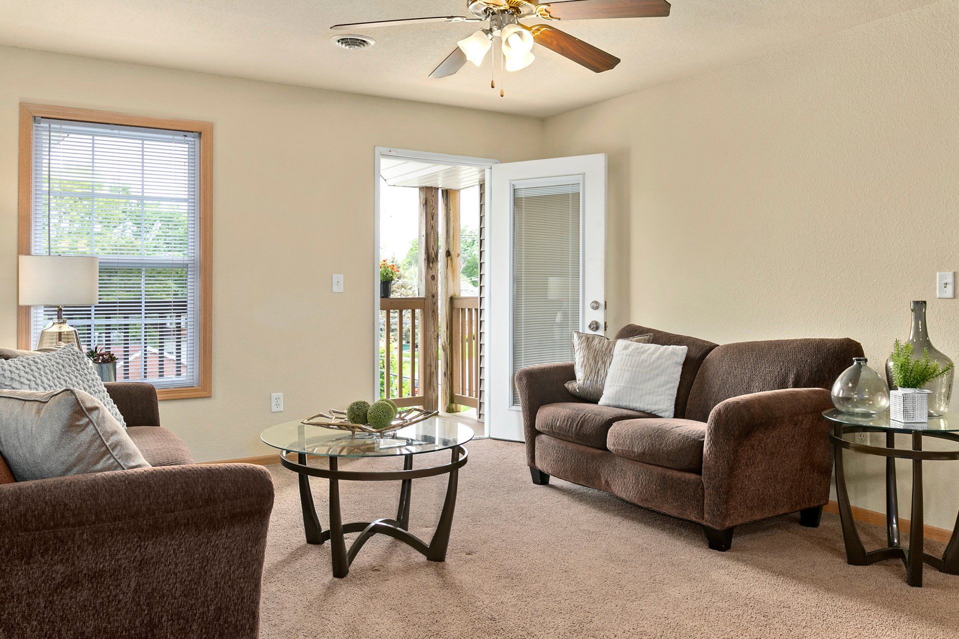 Fully furnished living room with couch, love seat, coffee table