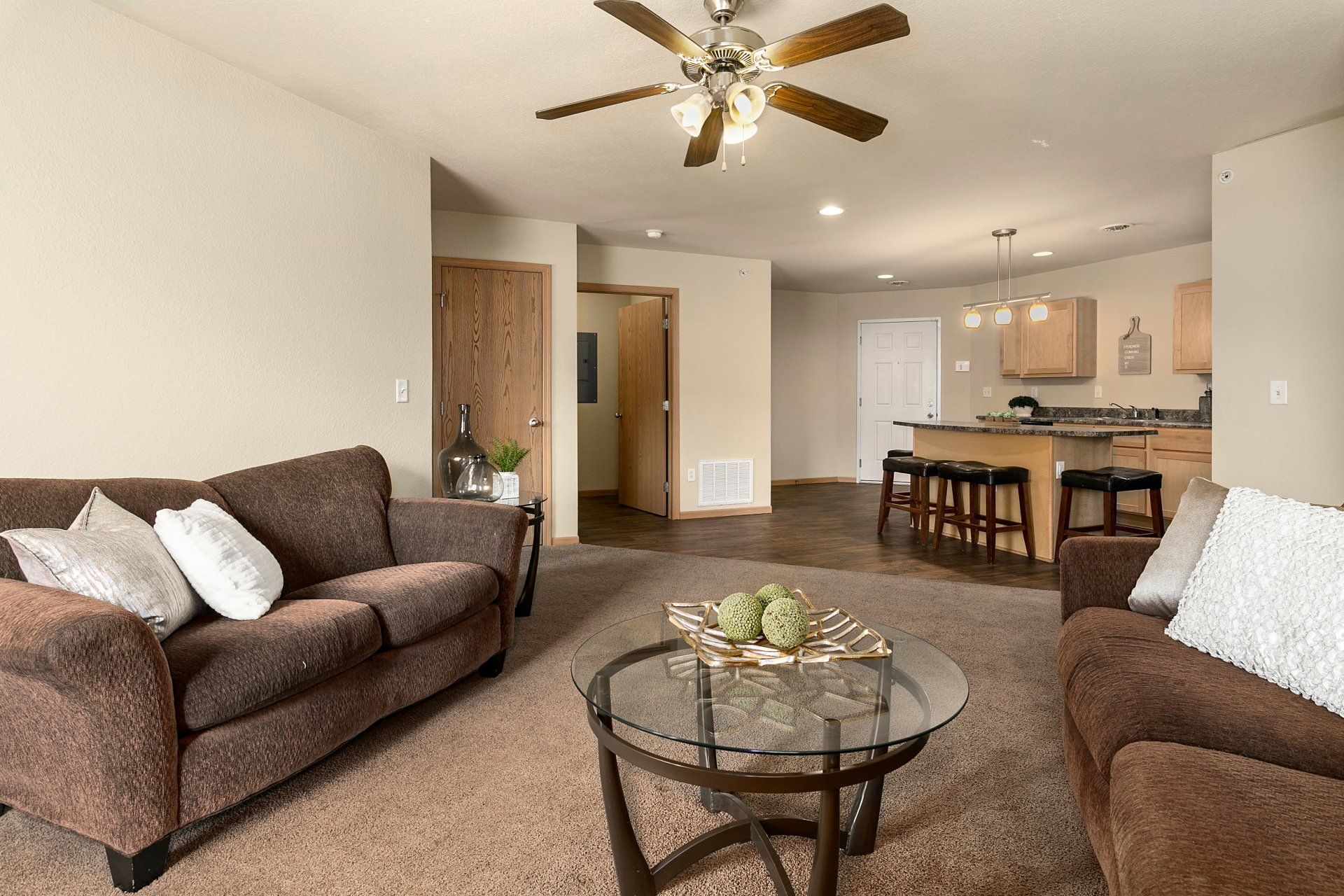 Fully furnished living room with couch, love seat, coffee table