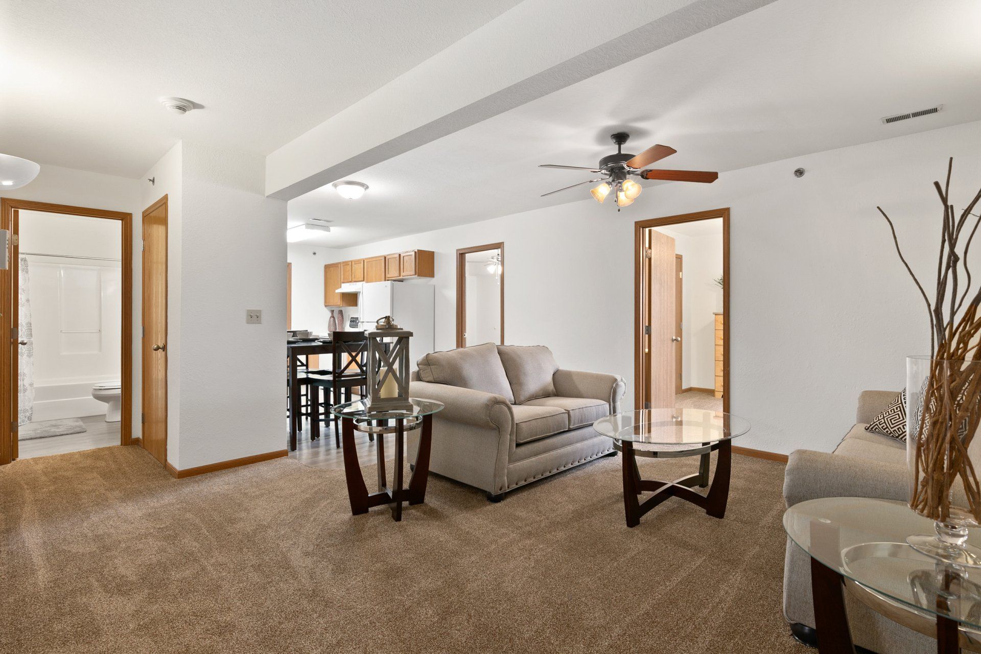 Fully furnished living room with couch, love seat, coffee table