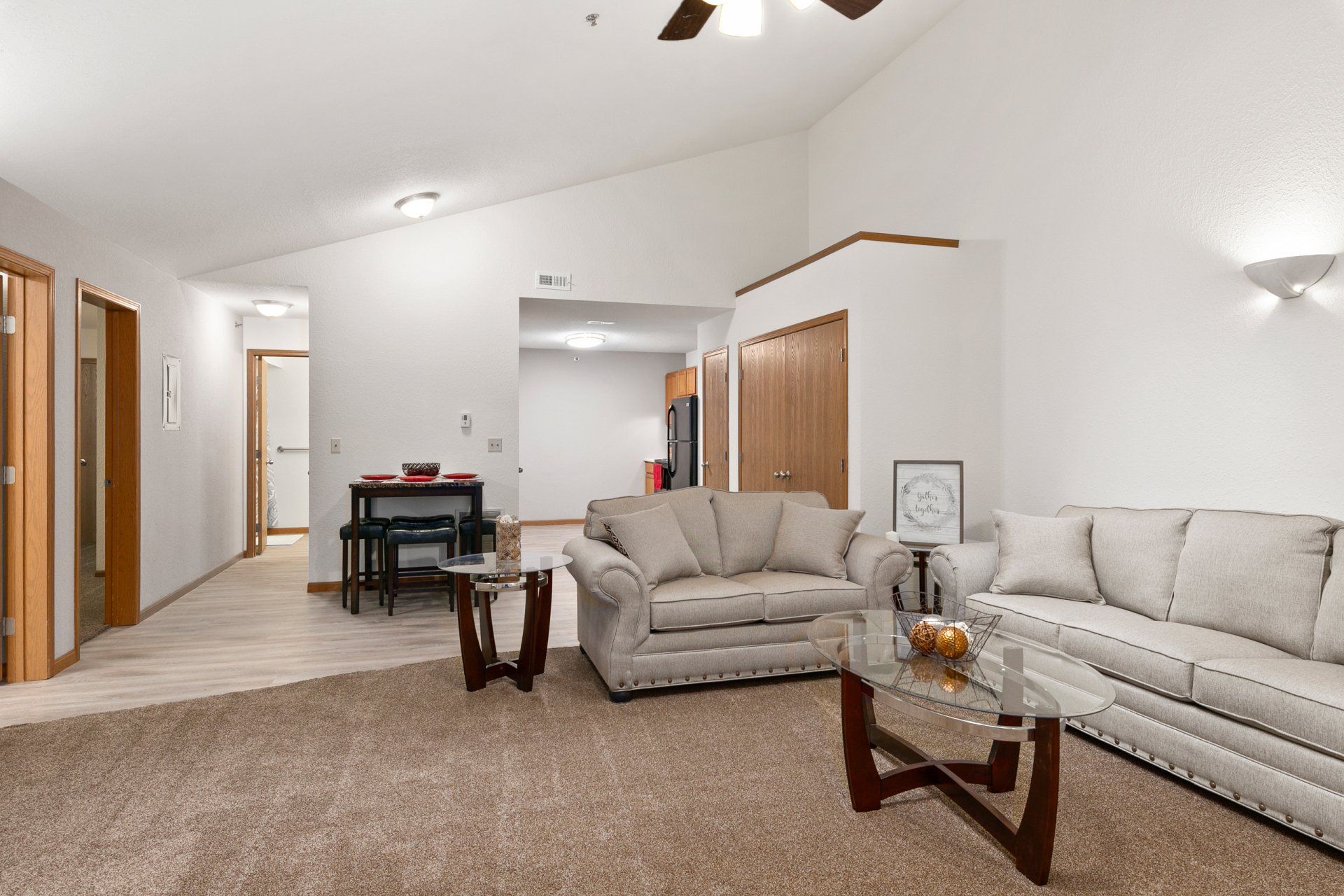 Fully furnished living room with couch, love seat, coffee table