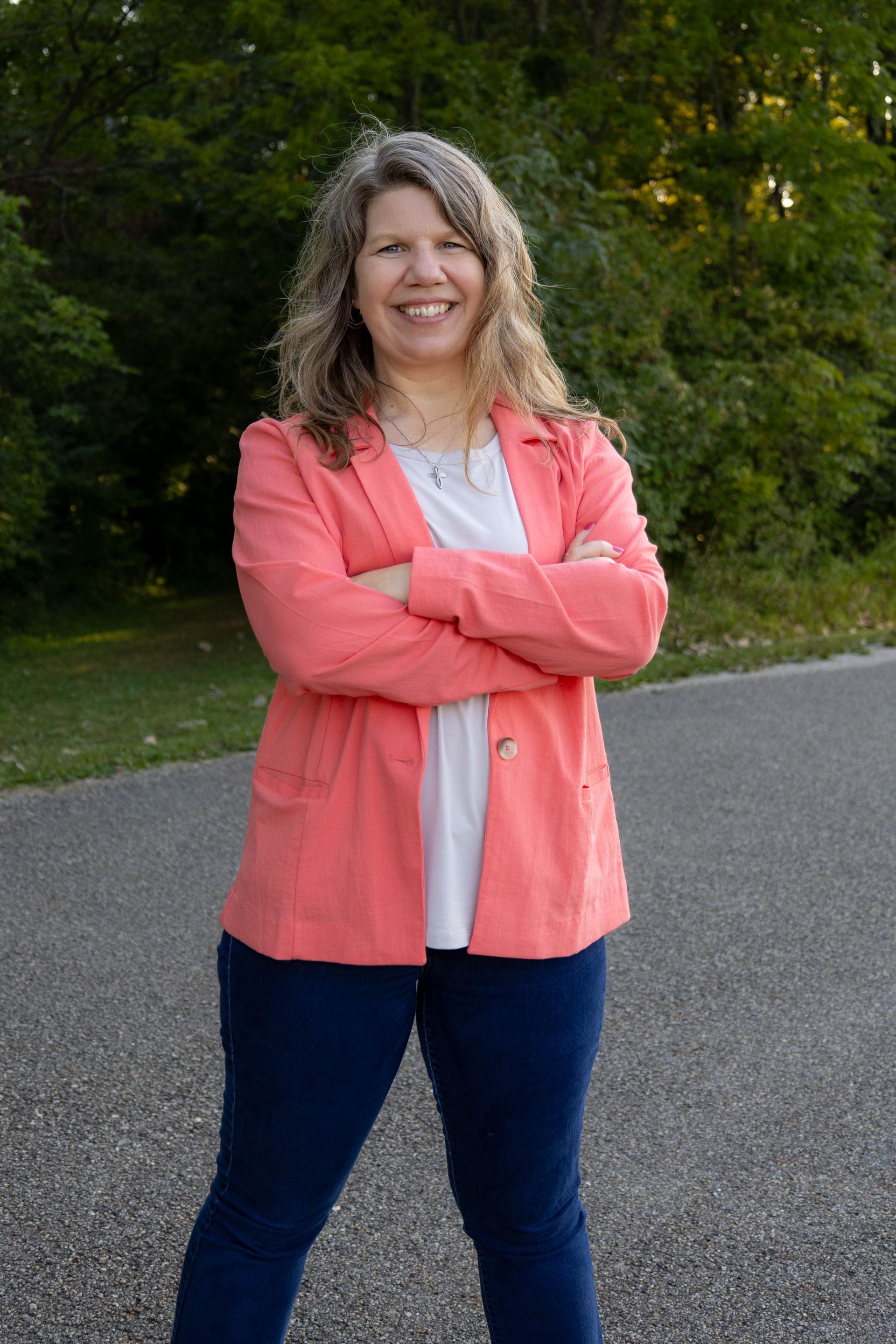 A person is holding a cell phone with envelopes coming out of it