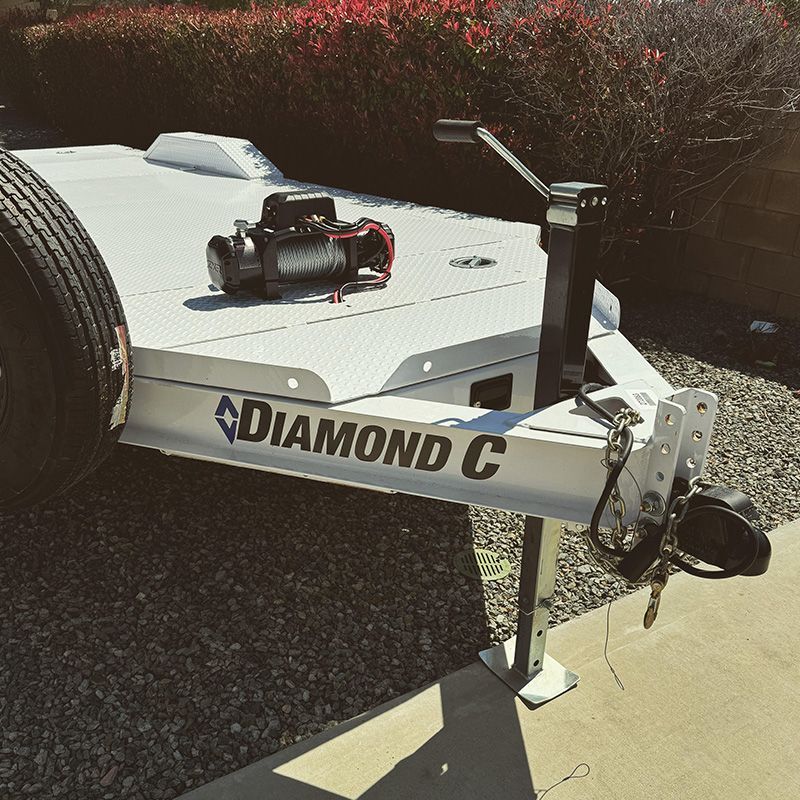 A Flatbed Car Trailer with a winch attached to it
