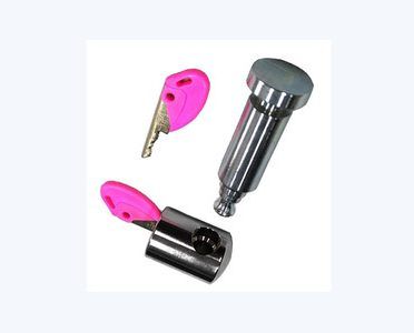 A chrome cylindrical locking mechanism with a pin, alongside a separate lock cylinder and a pink key.