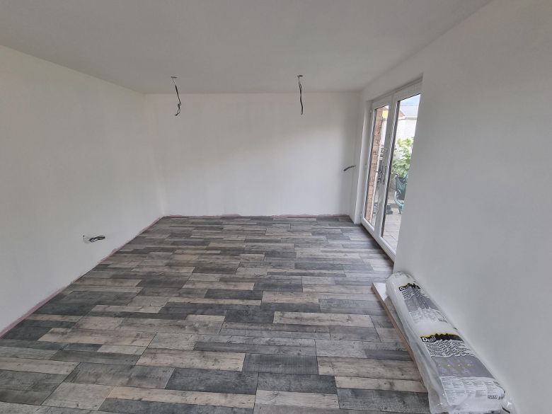 internal view of garage conversion with new flooring
