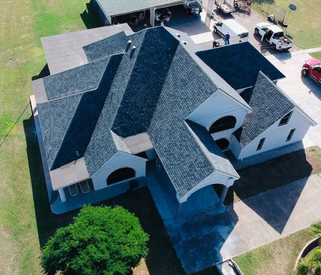 Huge White House With Blue Roof