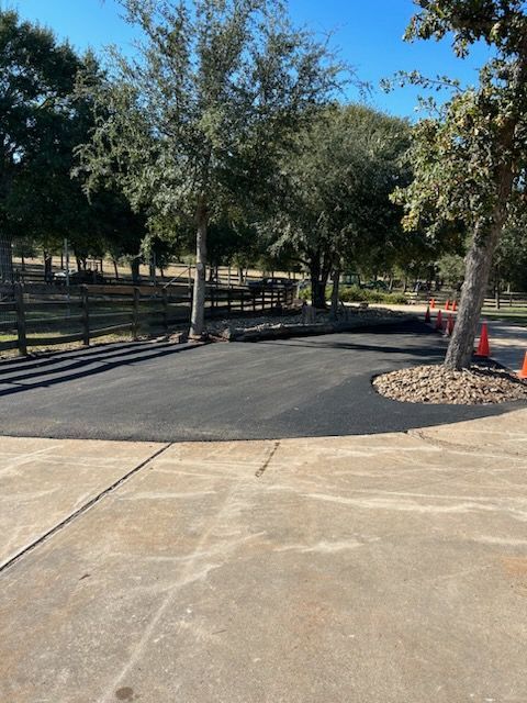 Paved Asphalt Driveway Curves Into a Small Circular Area — Sealy, TX — Sealy Paving, Inc.
