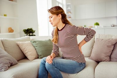 Woman Having a Back Pain — Bayonne, NJ — Neurology Partners of Hudson County, PA