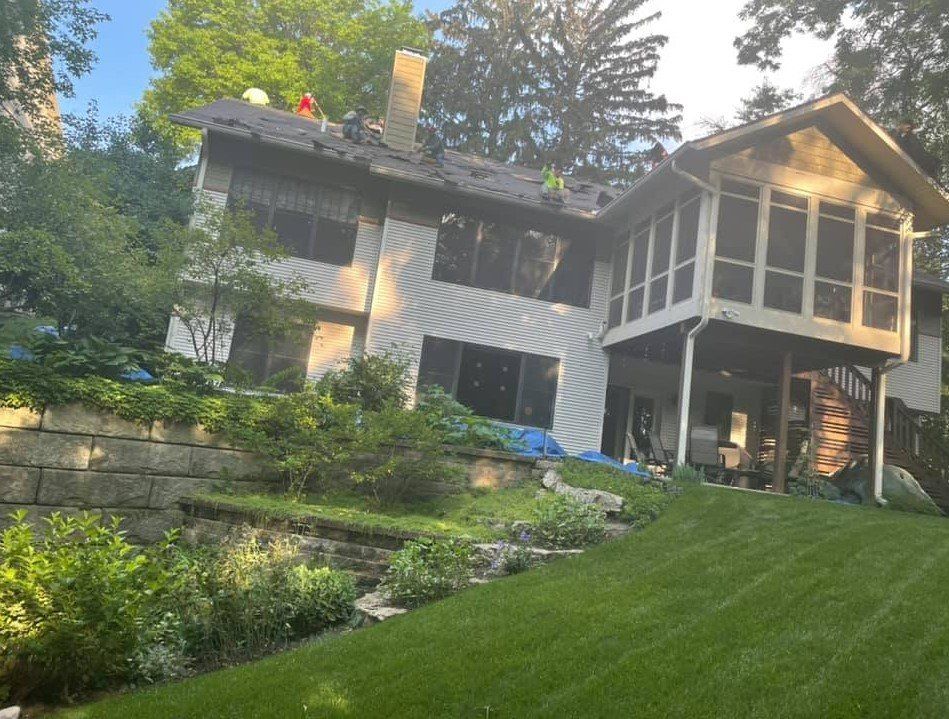 Construction Workers Repairing House Roof - West Liberty, IA - DHG Construction LLC