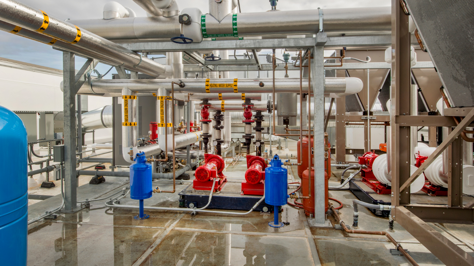 A large room filled with lots of pipes and pumps.