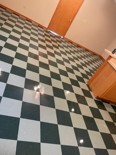 A black and white checkered floor in a kitchen