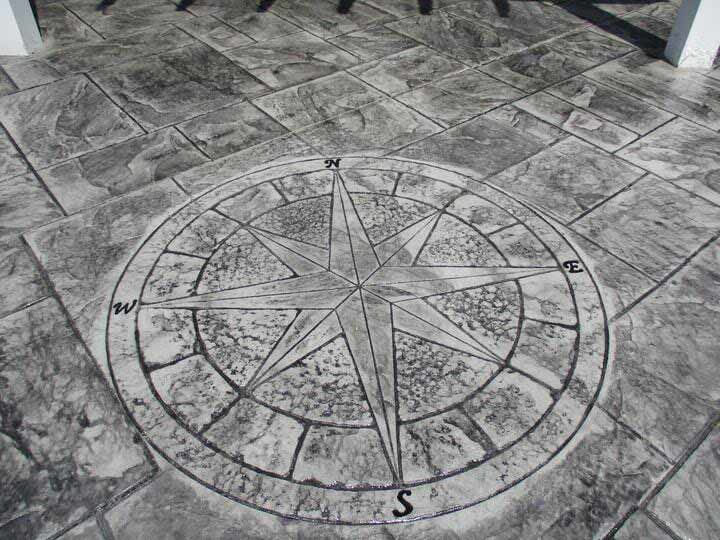 A compass on a concrete floor