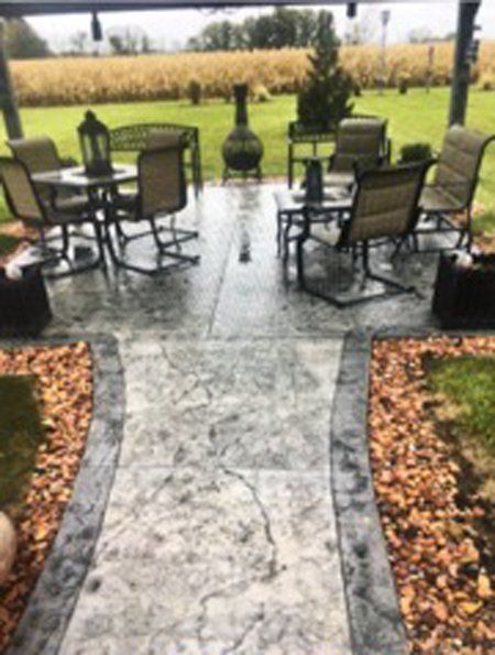 A nice patio with a table and chairs on it