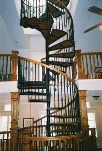 A spiral staircase leading up to the second floor of a house