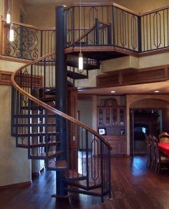 A spiral staircase leading up to the second floor of a house