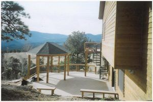 A picture of a house with a gazebo in the background