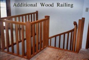 A picture of an additional wood railing on a staircase