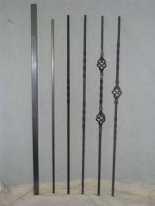 A group of metal poles sitting on top of a white cloth.
