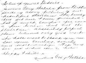 A close up of a handwritten letter on a white background.