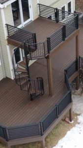 An aerial view of a wooden deck with a spiral staircase.