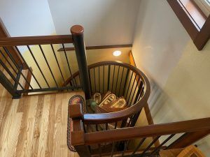 An aerial view of a spiral staircase in a house.