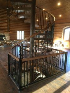 There is a spiral staircase in the middle of the room.