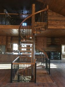 There is a spiral staircase in the middle of the room.
