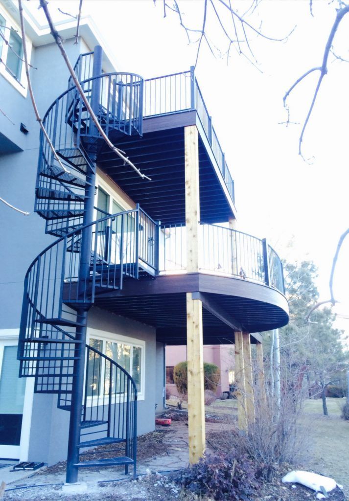 A house with a spiral staircase on the side of it