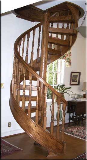 A wooden spiral staircase in a living room