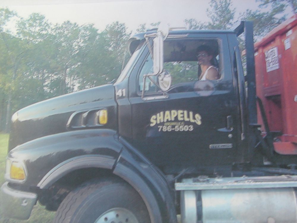 A black truck with the word shapells on the side