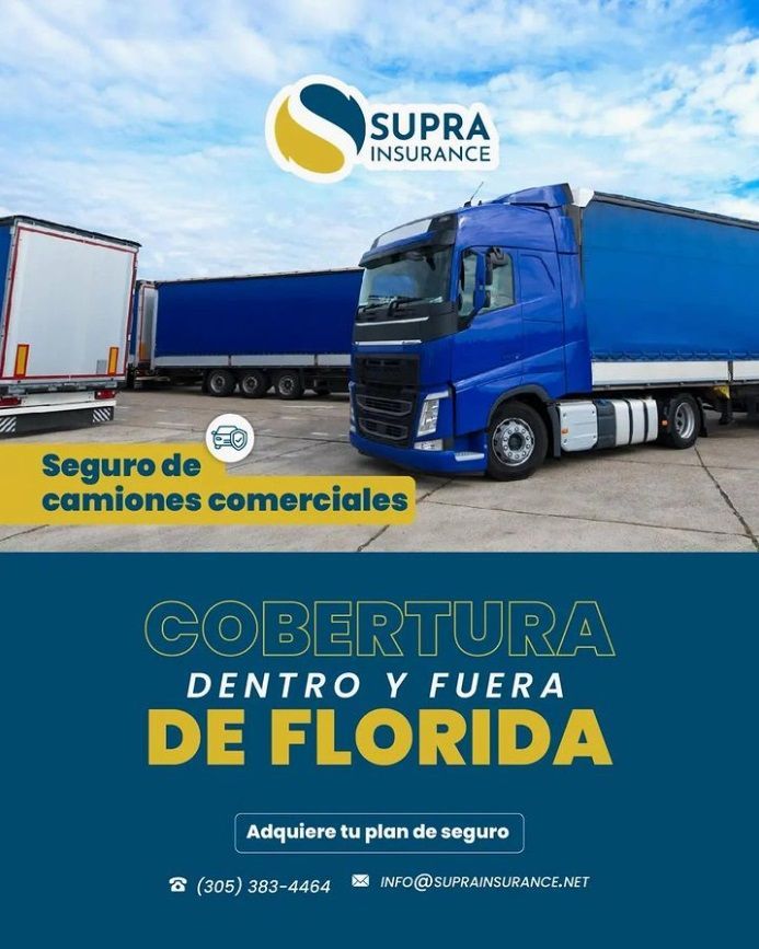 A blue truck is parked in a parking lot.