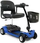 Blue mobility scooter with a black seat and basket.