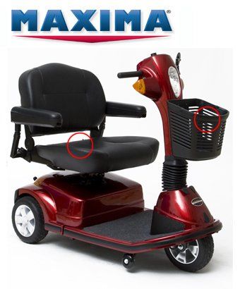 Red Maxima mobility scooter with a black seat and basket, indoors.