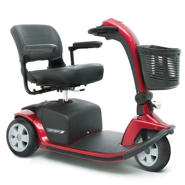 Red three-wheeled mobility scooter with black seat, basket, and armrests.