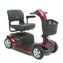 Red mobility scooter with black seat and basket.